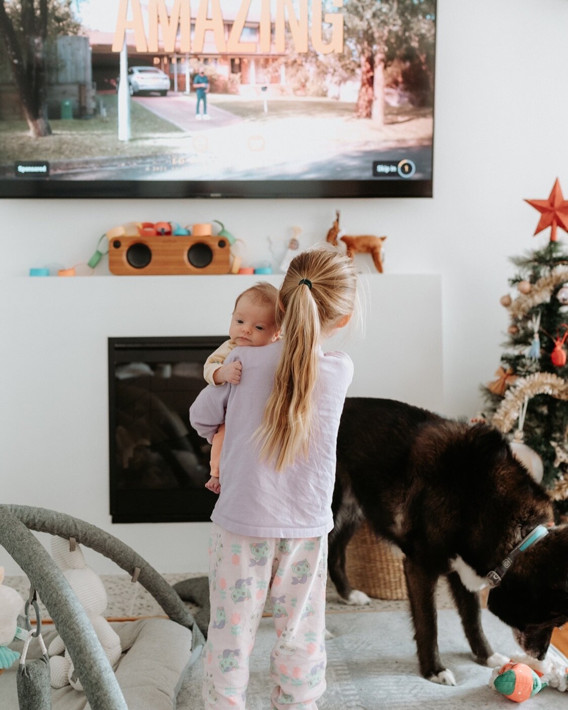 Life lately.
This shot sums up our post partum days pretty well. Newborn is the only one in the house not wearing pjs, Christmas tree decorated creatively by our five year old. The dog, playing with a Christmas toy, random clutter and of course the w