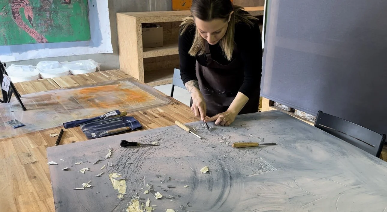 Ece Abay carving wood for woodcut print making