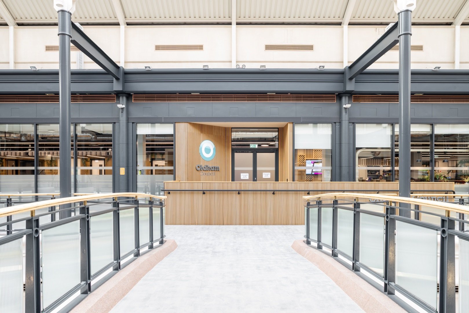 Refurbished civic interior at Oldham featuring a modern public service hub within a repurposed town centre building