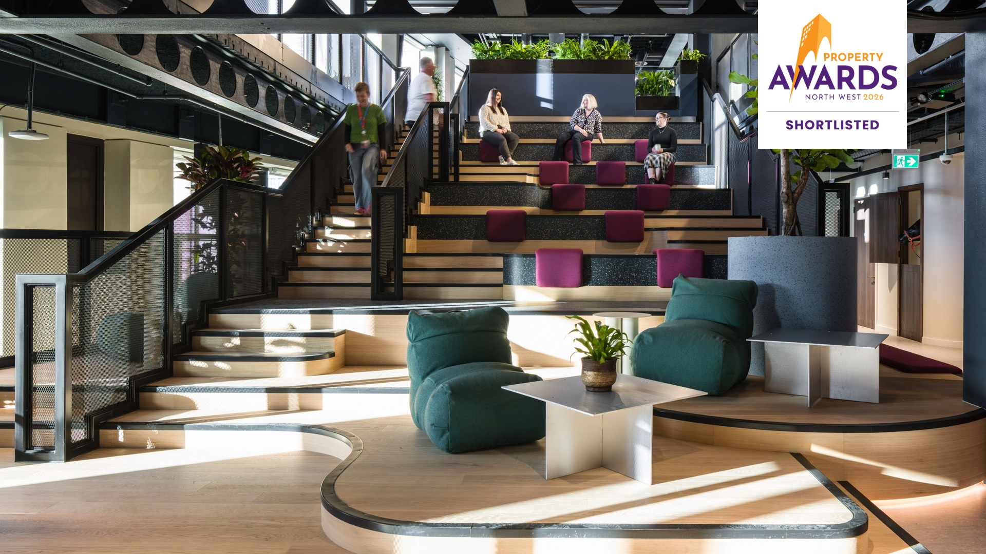 Virgin Media O2 Manchester HQ workplace interior showing collaborative spaces, bleacher seating and biophilic design elements