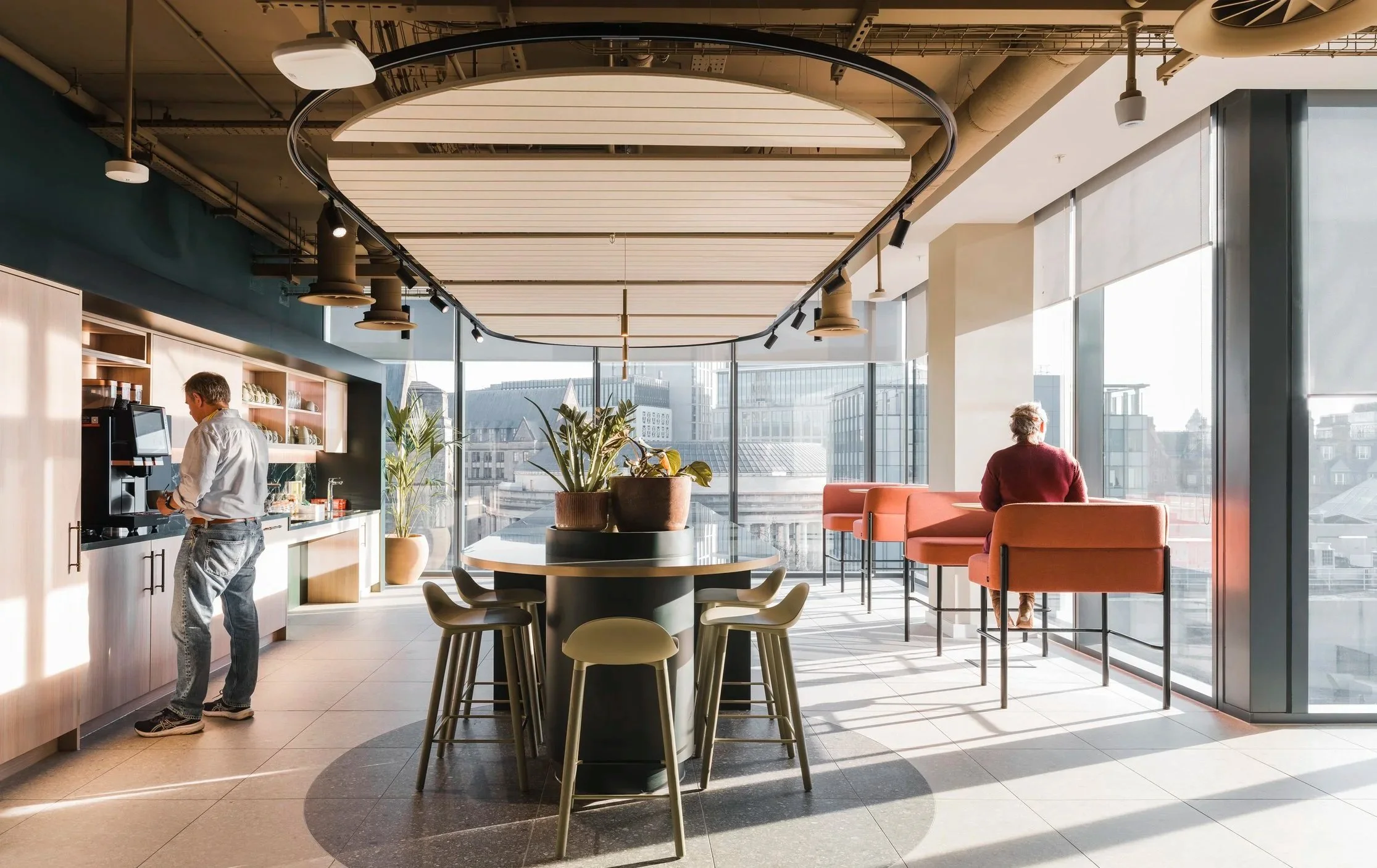 Breakout café space within a multinational legal workplace, designed to support informal connection