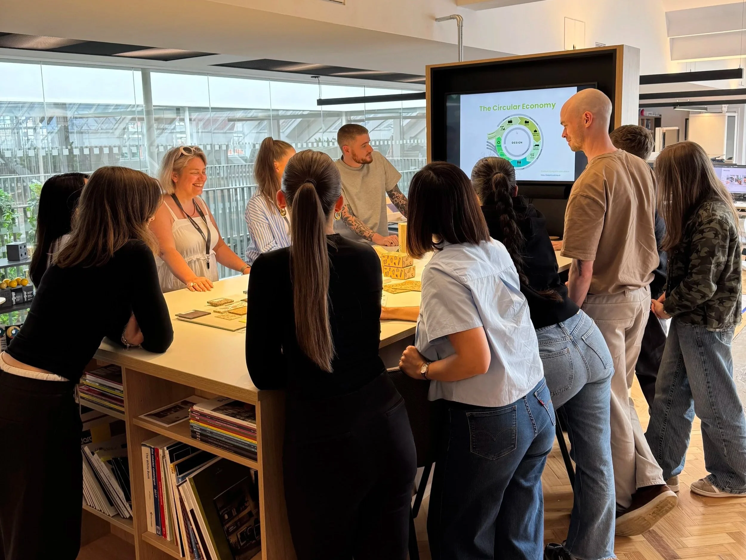 SpaceInvader team discussing sustainable materials and circular interior design