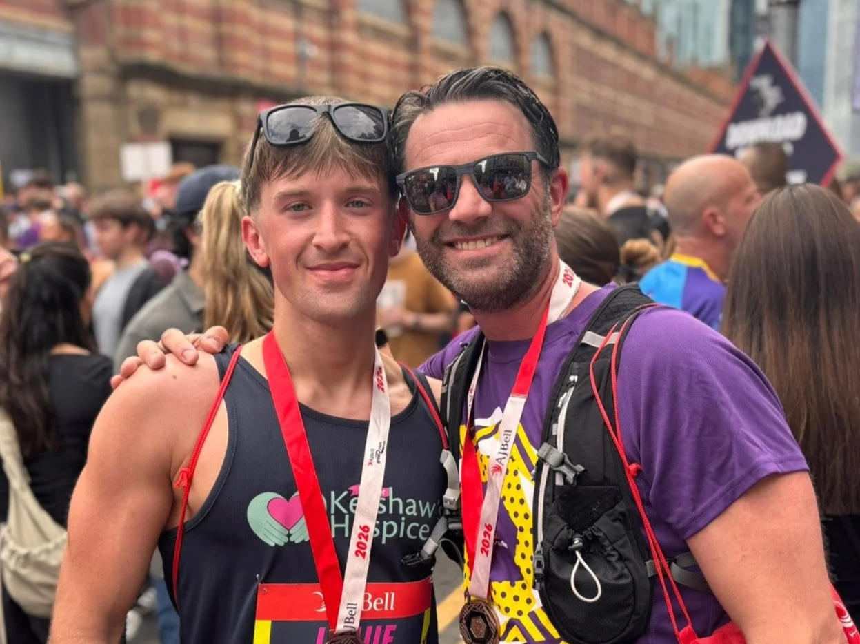 SpaceInvader Founder and Director John Williams celebrates completing the AJ Bell Great Manchester Run after raising funds for Alzheimer's Society.