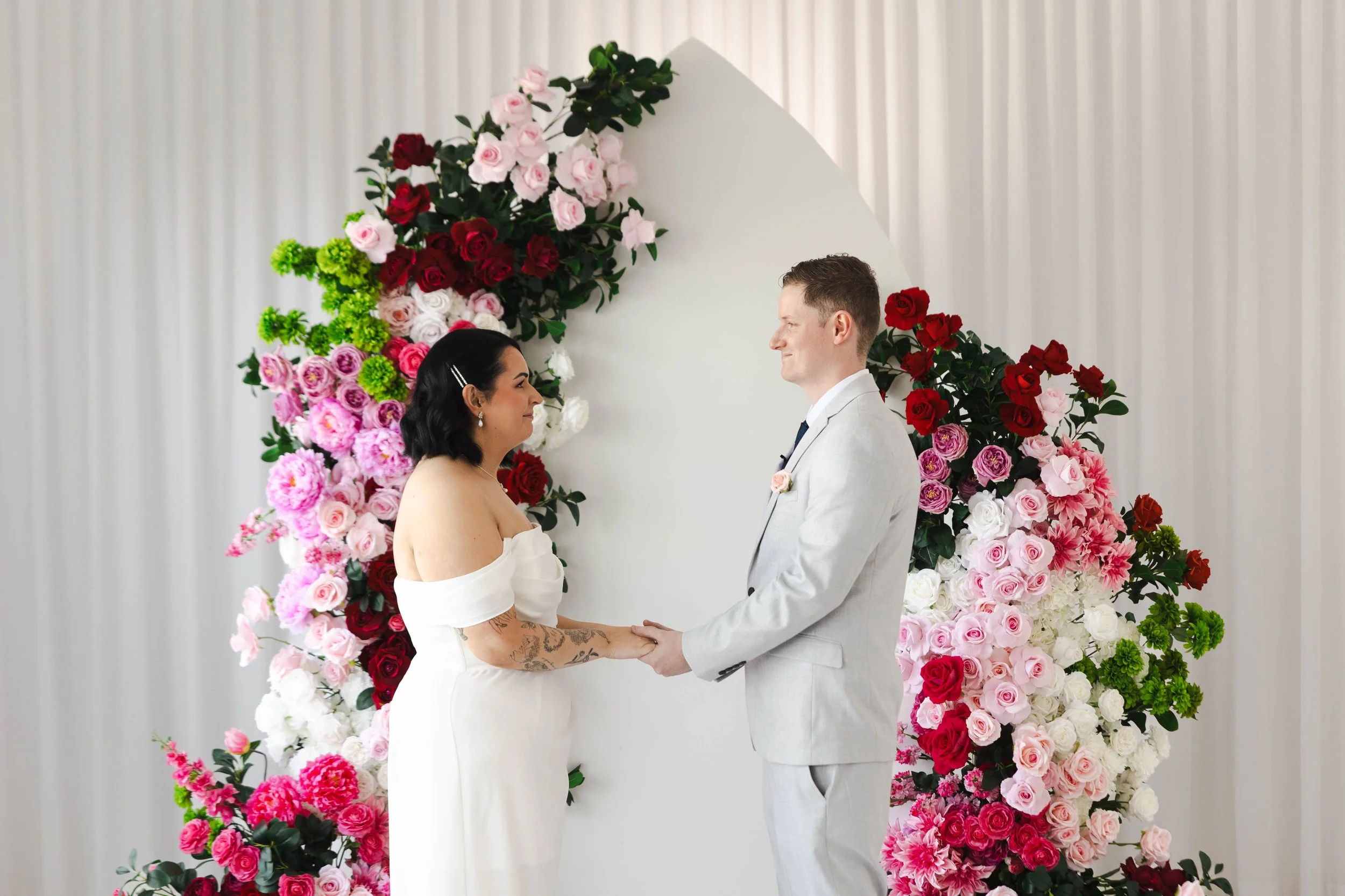 Shannon & Jarred's wedding at Faithwood Chapel – bride and groom holding hands at the ceremony
