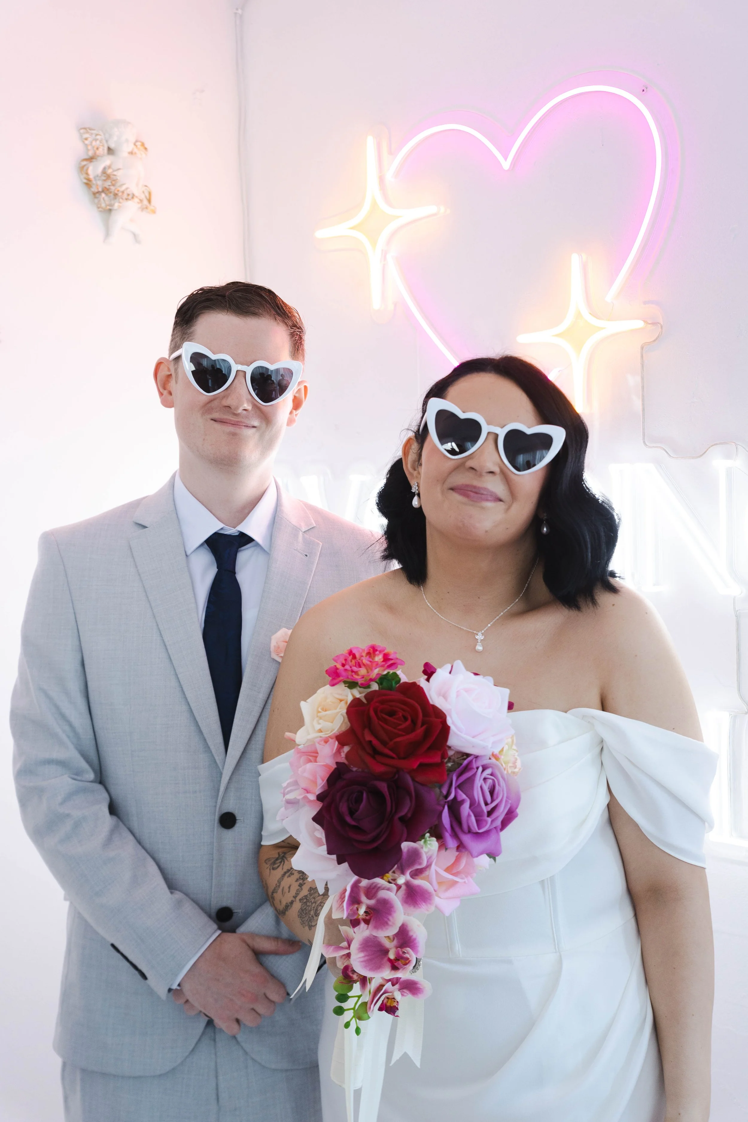 Shannon & Jarred's wedding at Faithwood Chapel – newlyweds having fun in heart-shaped sunglasses