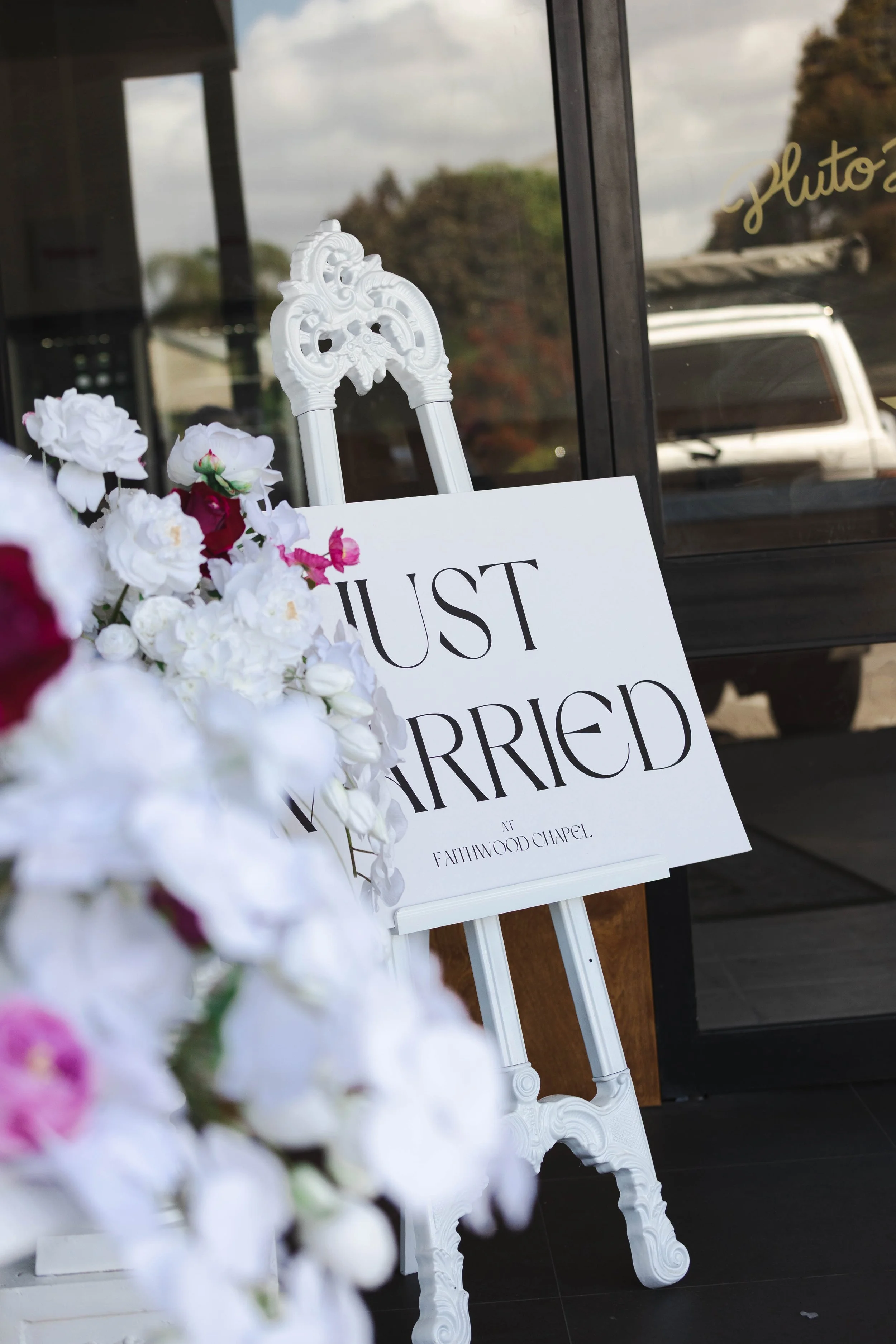 Shannon & Jarred's wedding at Faithwood Chapel – white chair and Just Married sign at the chapel