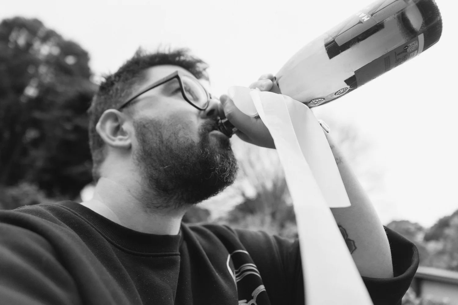 Dan Glasgow, Adelaide wedding photographer and videographer, celebrating with a bottle of bubbly