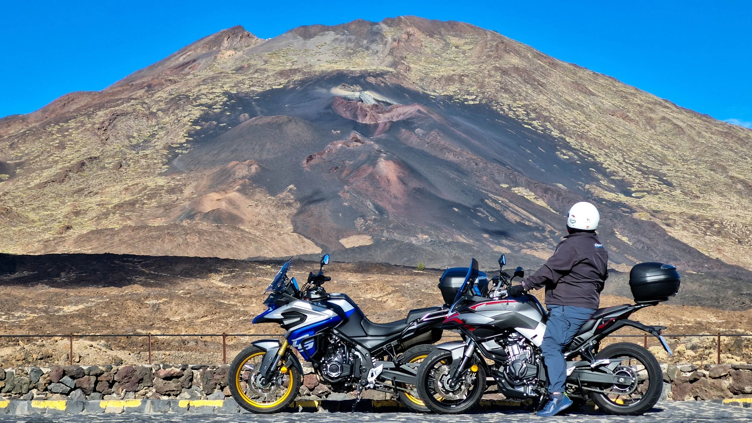 Motorcyclist looking at the Pico Viejo volcano on Tenerife