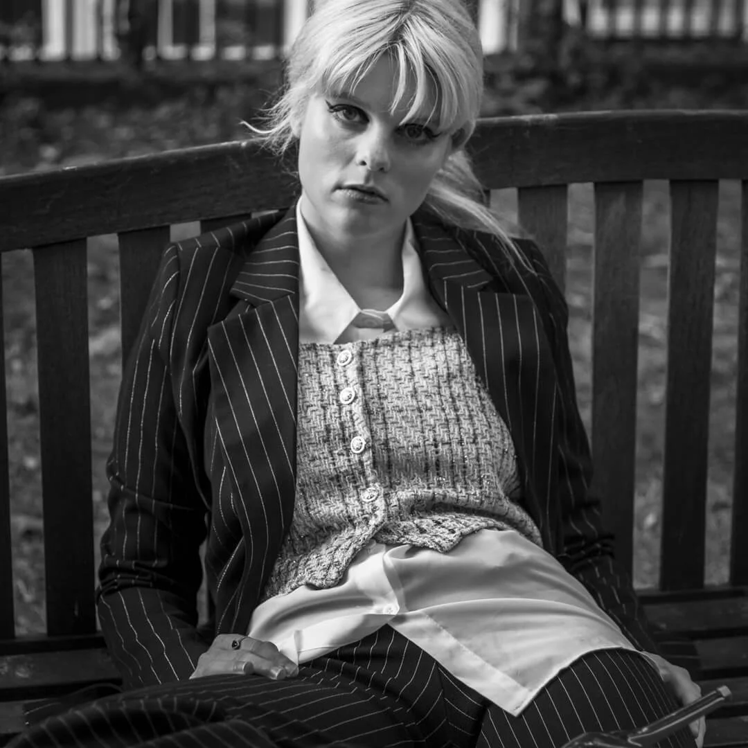 woman sit slouch bench