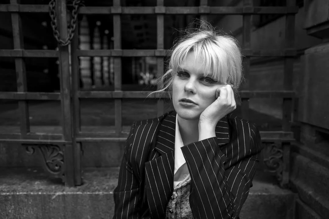 woman sitting steps gangster