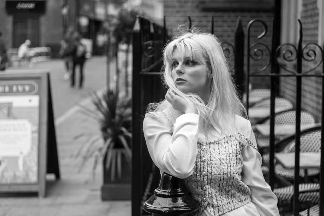 woman waiting city