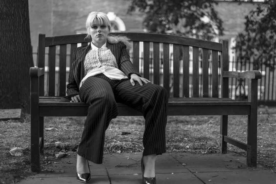 woman sitting bench slouch