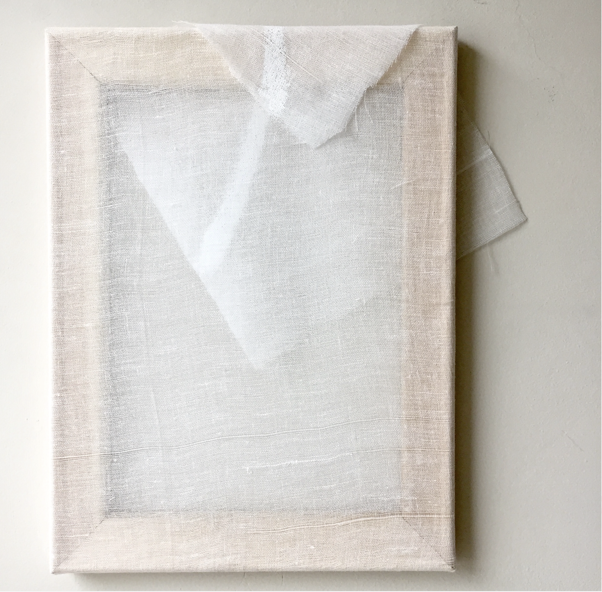 Subtle abstract mixed media piece with sheer white fabric draped over a white canvas