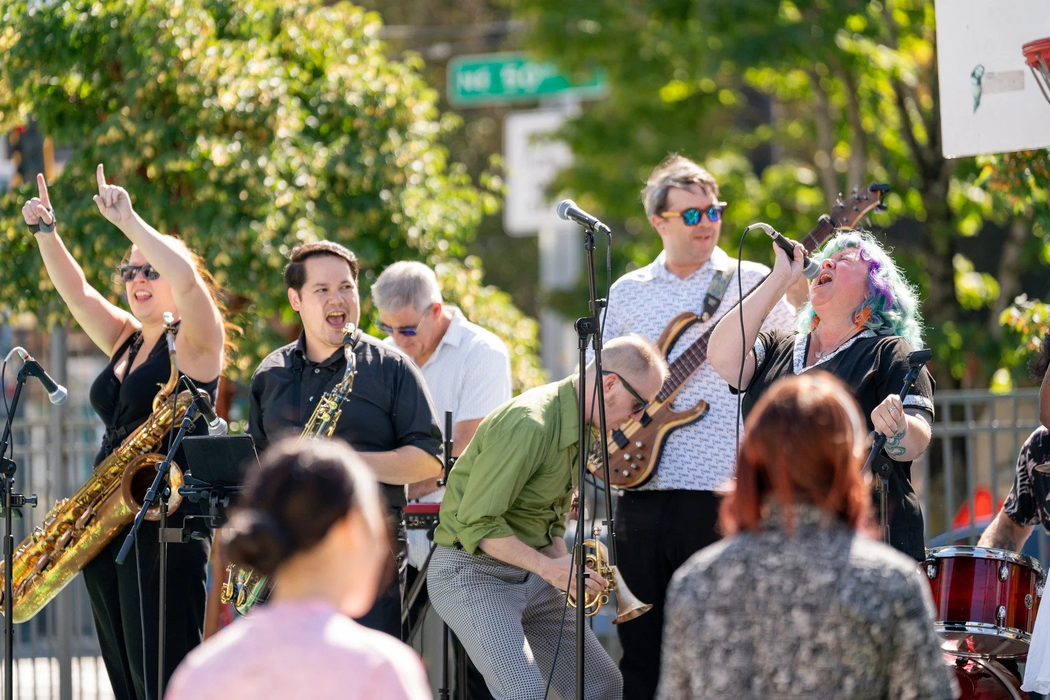 Yes, this was September, and it was golden. ☀️But community doesn't pause when the weather does. These moments, a band filling the plaza with music, neighbors moving together, a volunteer leaning in to help a kid create something, they capture why we
