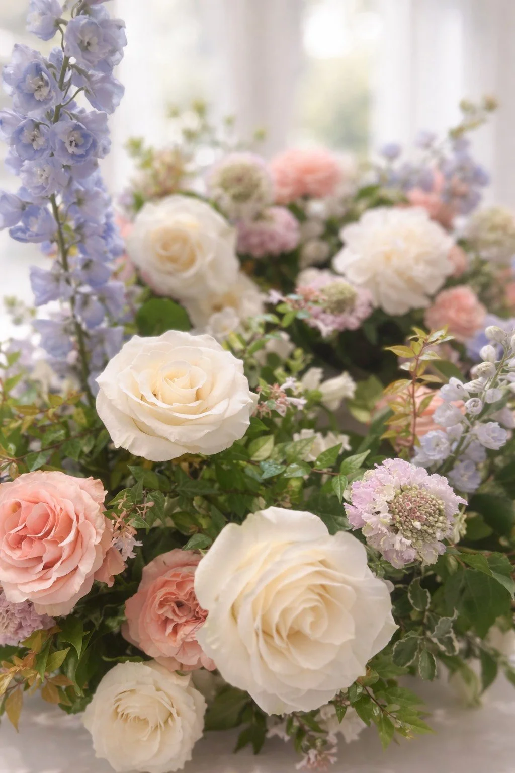 Baby shower floral arrangement with garden roses