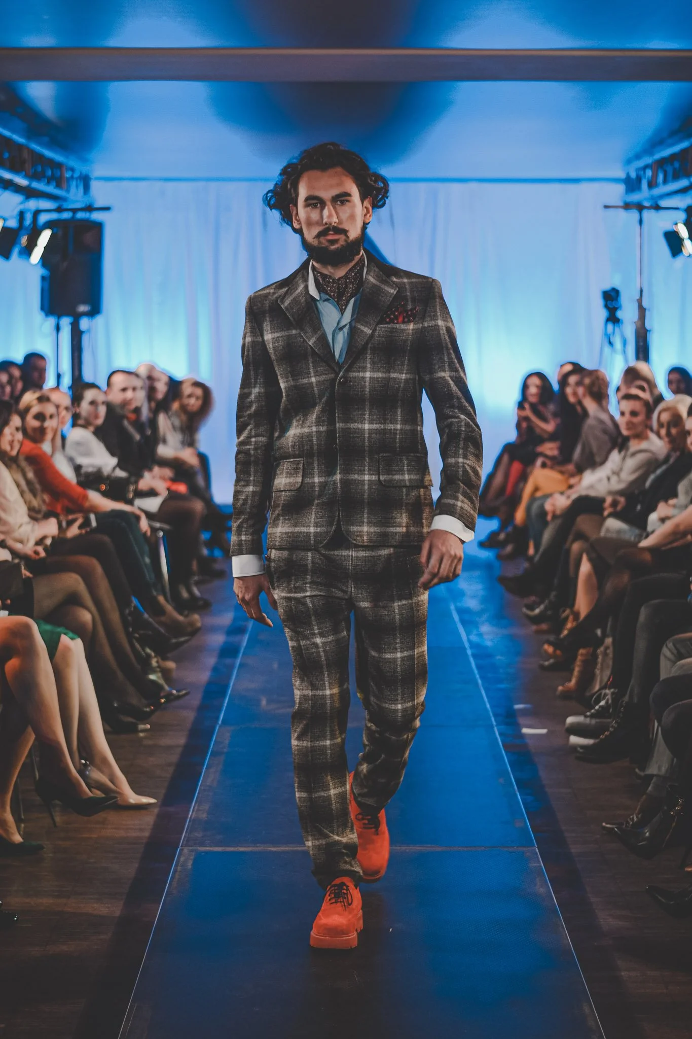 Model walking towards the camera at a fashion show in Cluj-Napoca