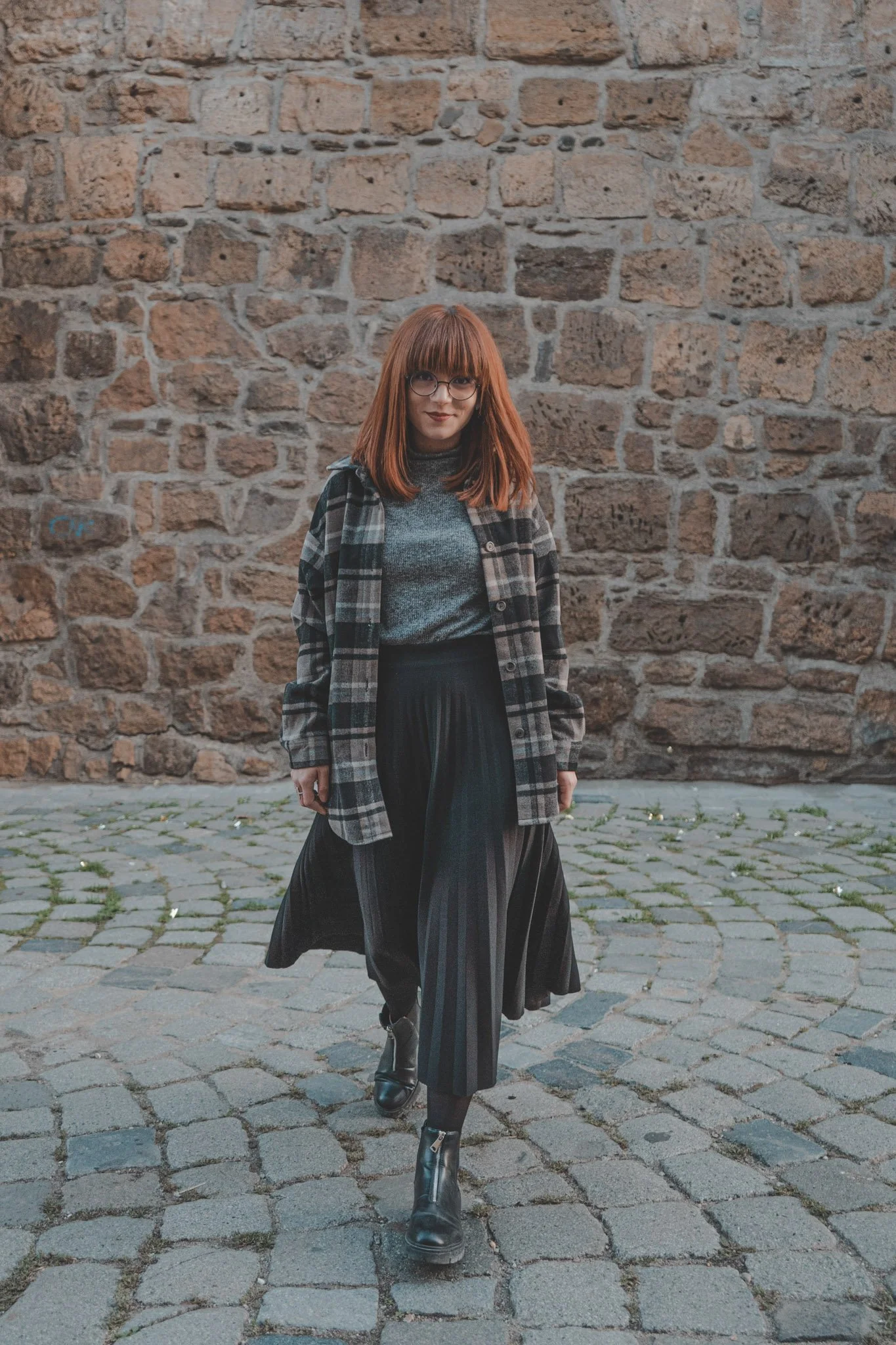 Young girl walking towards the camera at Bastionul Croitorilor in Cluj-Napoca, Romania