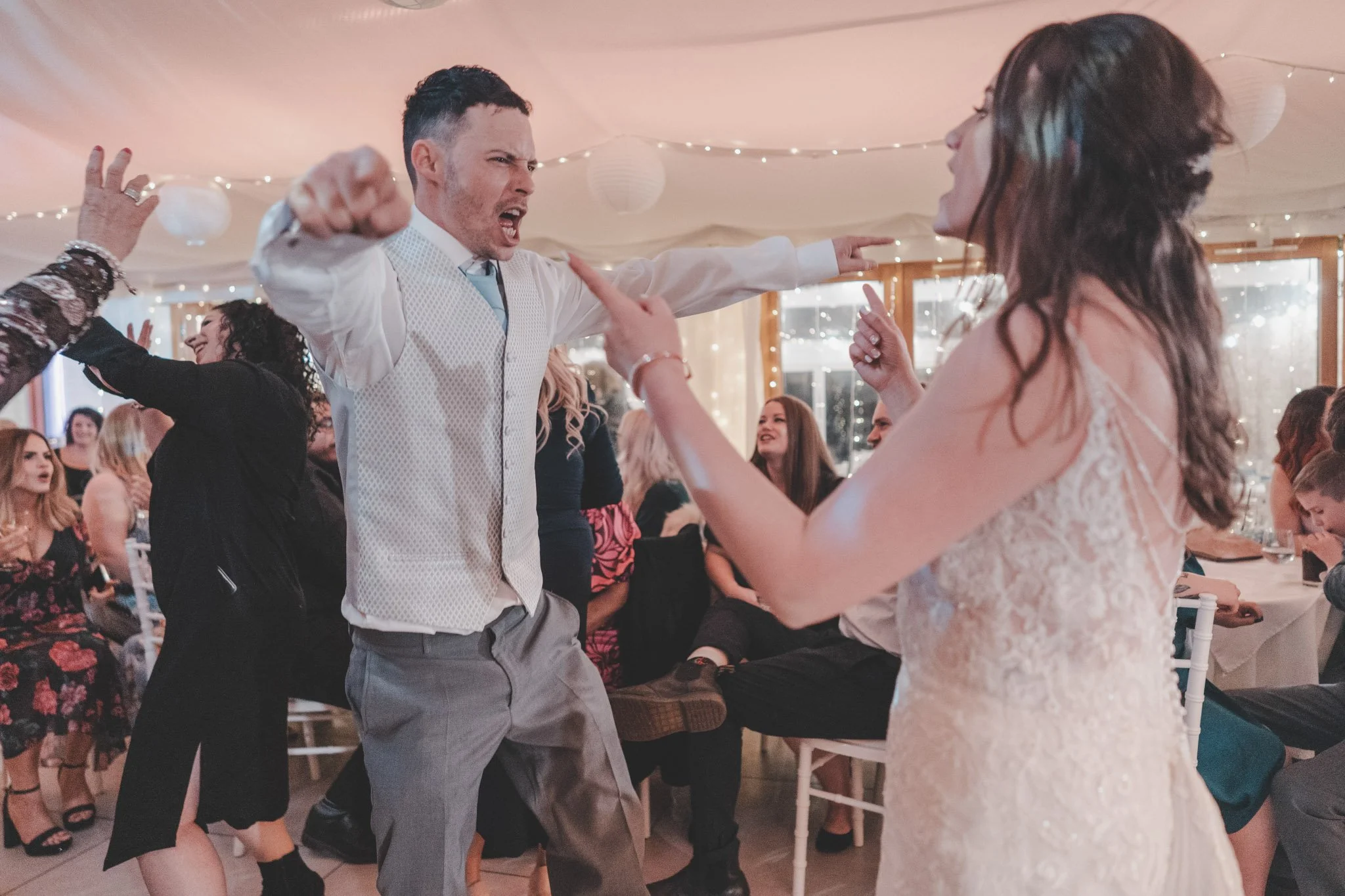 Bride and groom dancing at their wedding in Wales