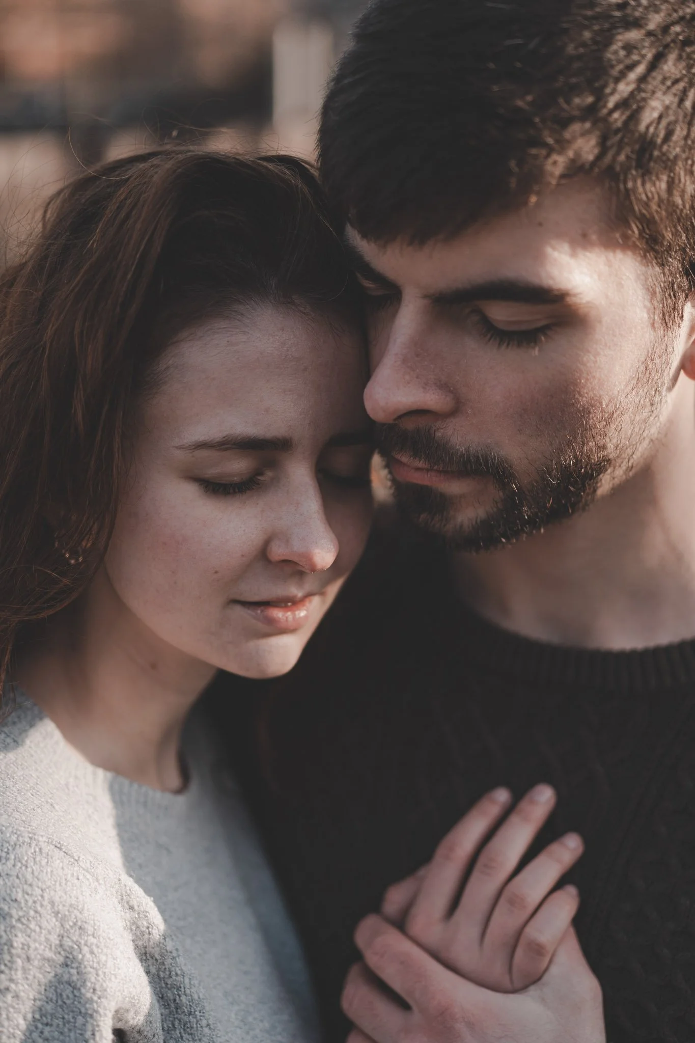 Close-up portrait of a young couple holding each other