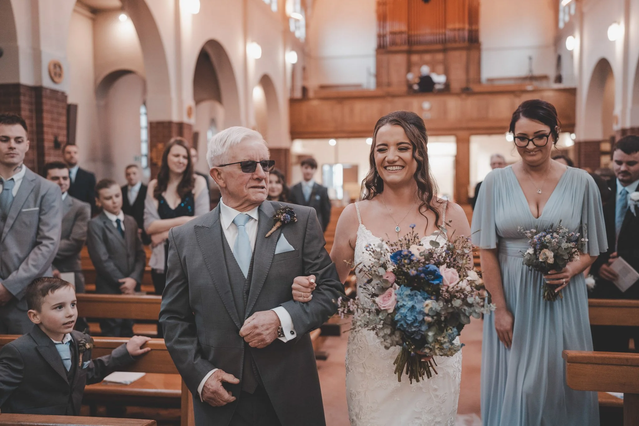 Dad and his daughter walking down the aisle in Pontypridd, Wales