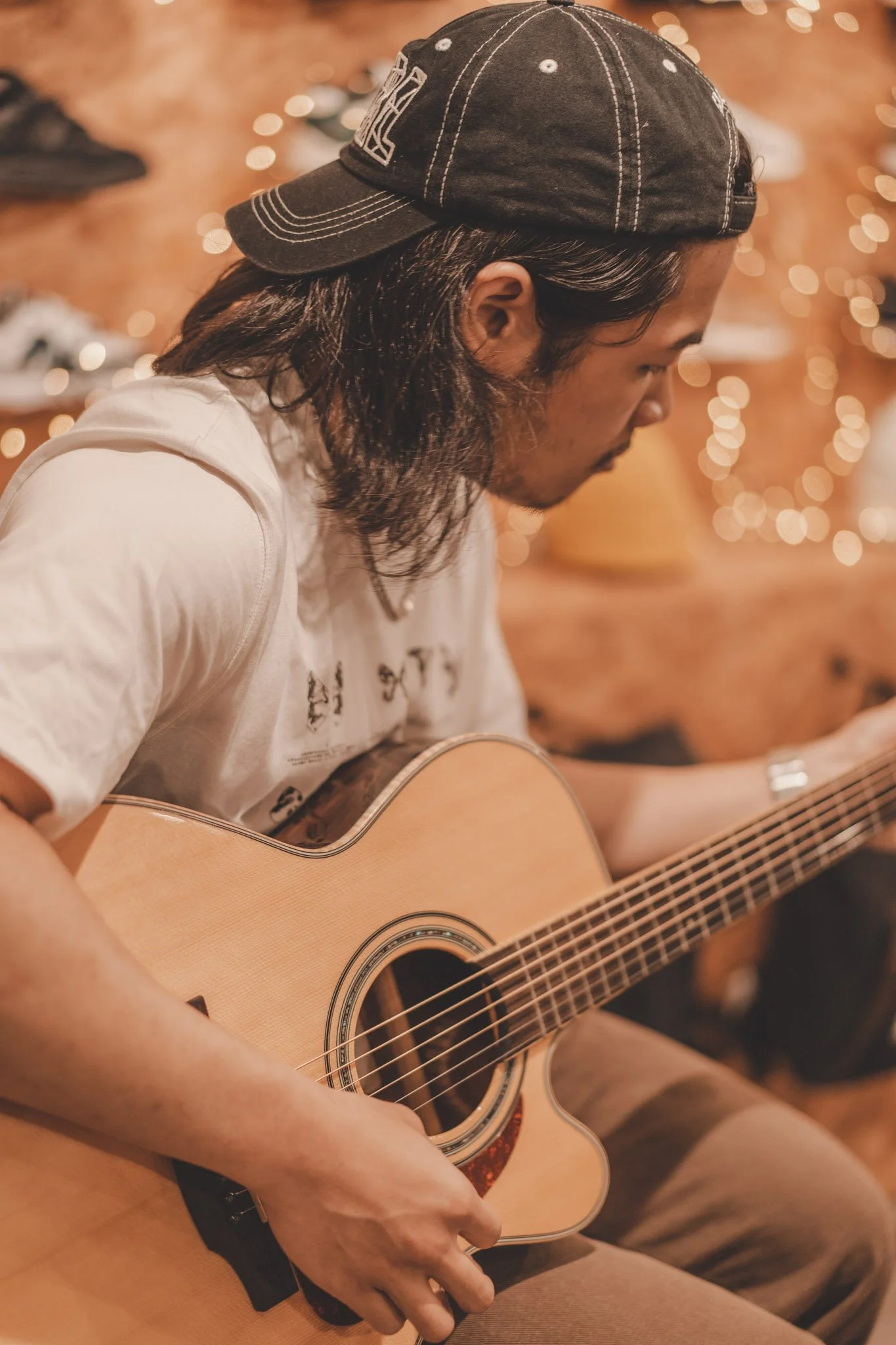 Guitar player performing for the Sofar Sounds Music Event at the Kong Store, Coventry