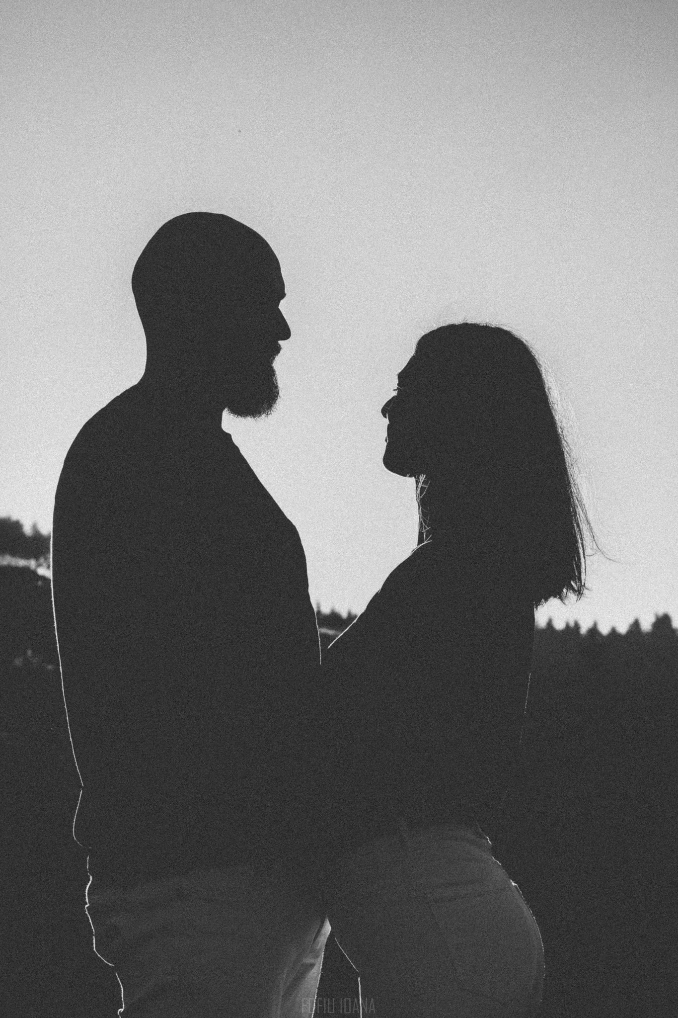 Black and white contre-jour photo of a young couple, Romania