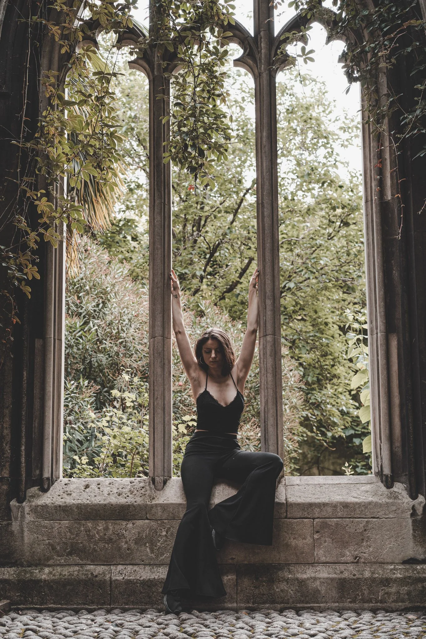 Girl posing for the camera at St Dunstan in the East Church Garden, London