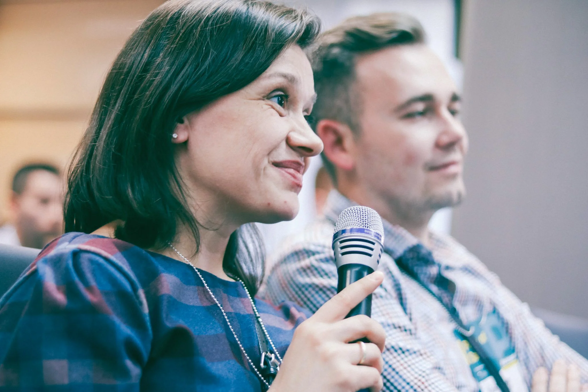Woman from the audience asking a question at the Pinch of Salt Conference, Romania