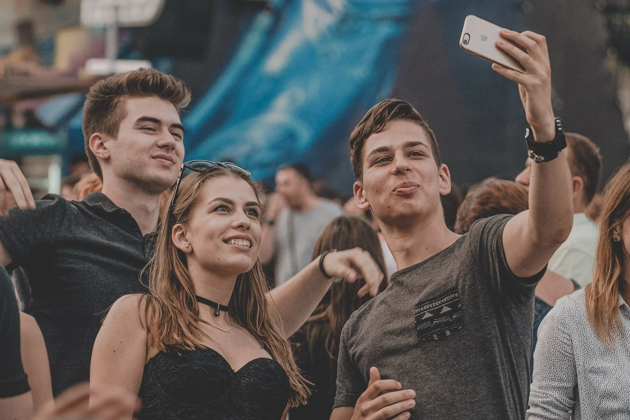 Group of friends taking a selfie at Untold festival in Cluj-Napoca, Romania