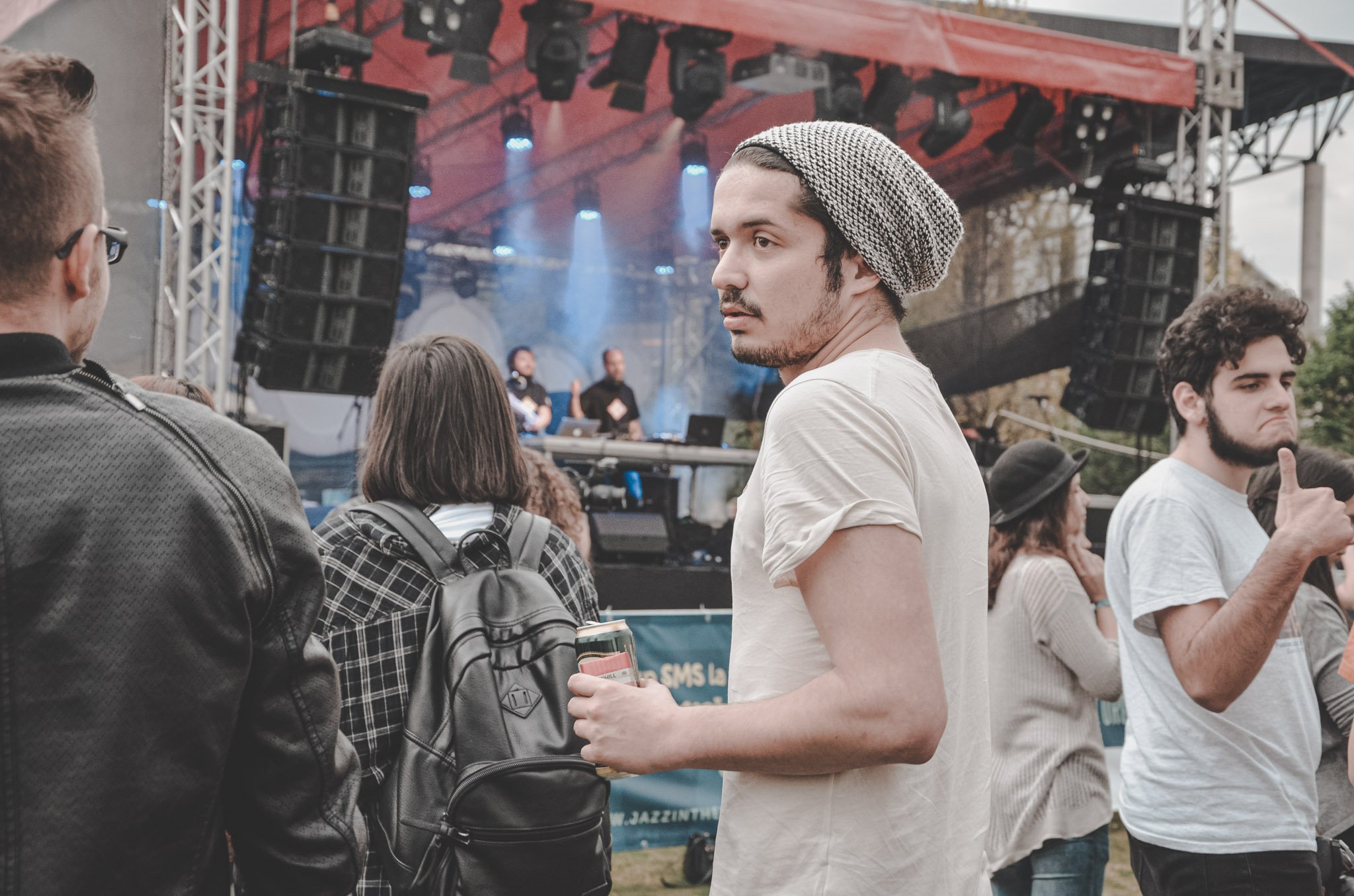 Boy photographed in front of a stage at an outdoor concert in Cluj-Napoca, Romania