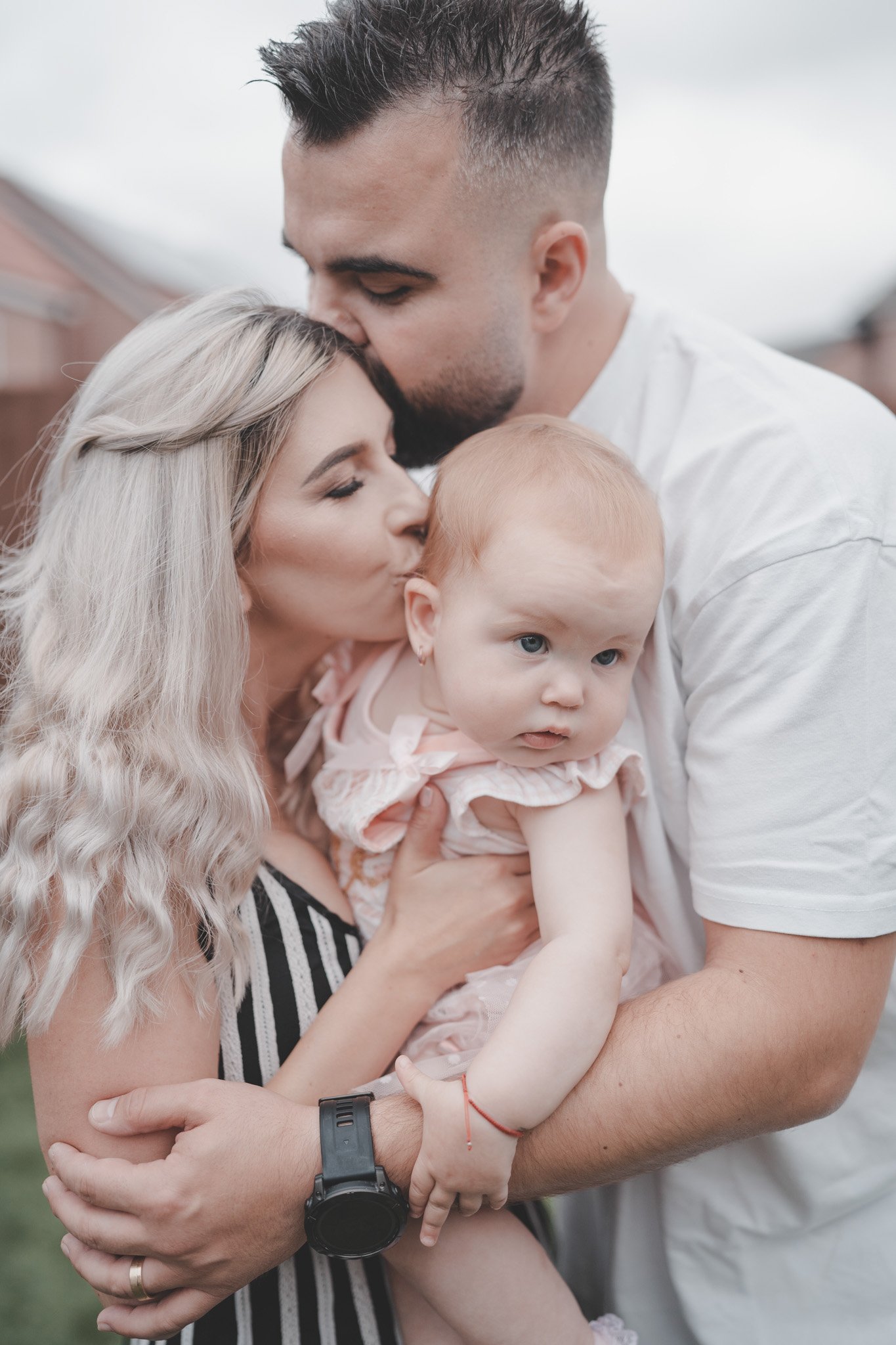 Family portrait of a dad, mom and their little girl in Coventry, West Midlands