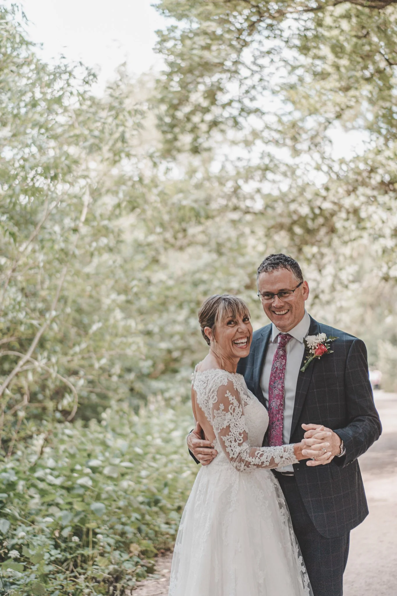 Couple dancing together in Coombe Abbey Park during their wedding day