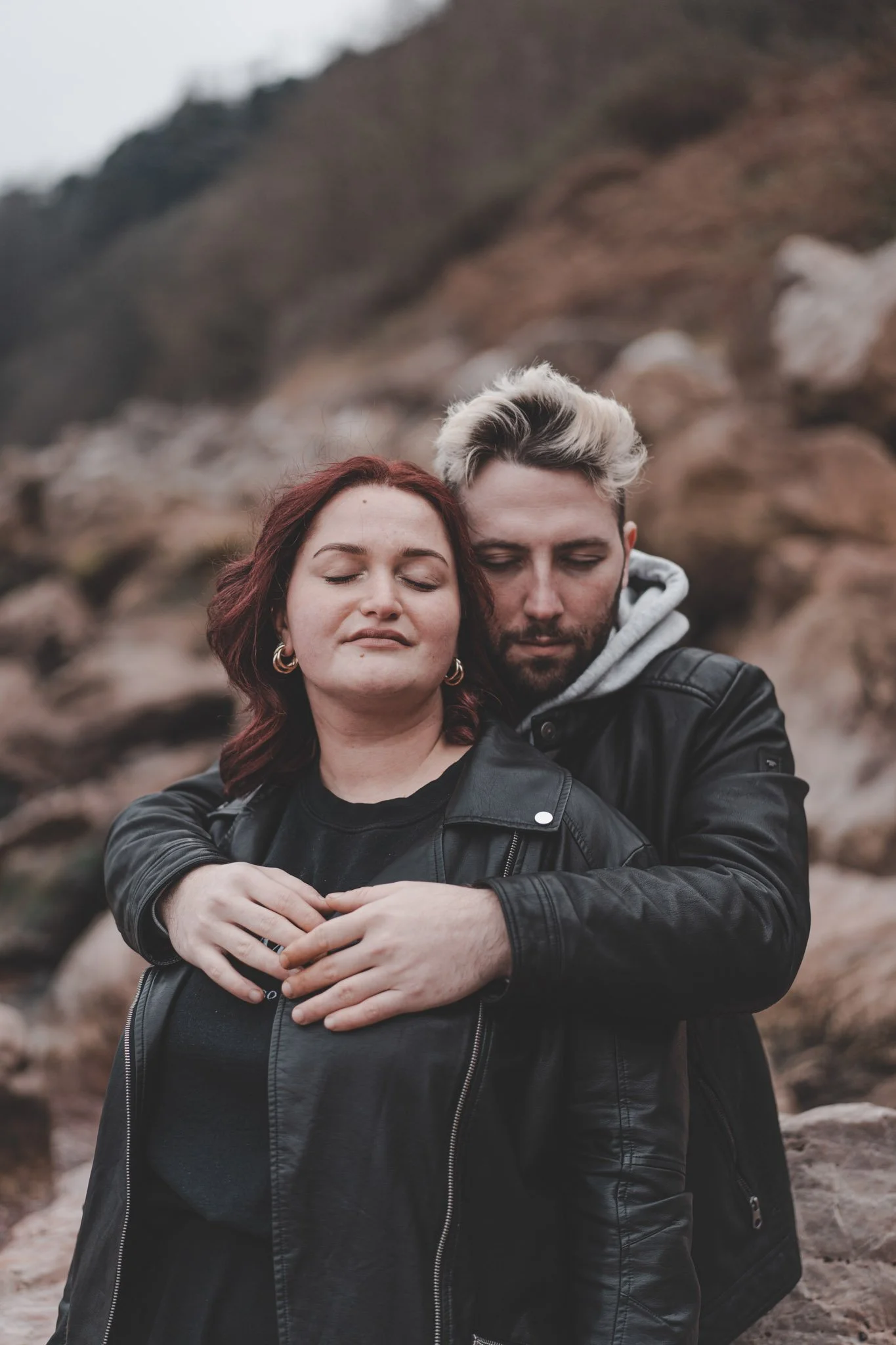 Photo of a boy holding his girlfriend on Torquay beach, Cornwall