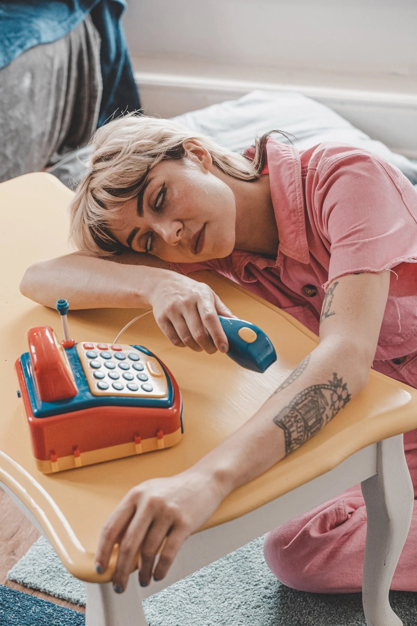 Photo of West Midlands singer Ynes playing with childrens toys at Ziferblat in Coventry