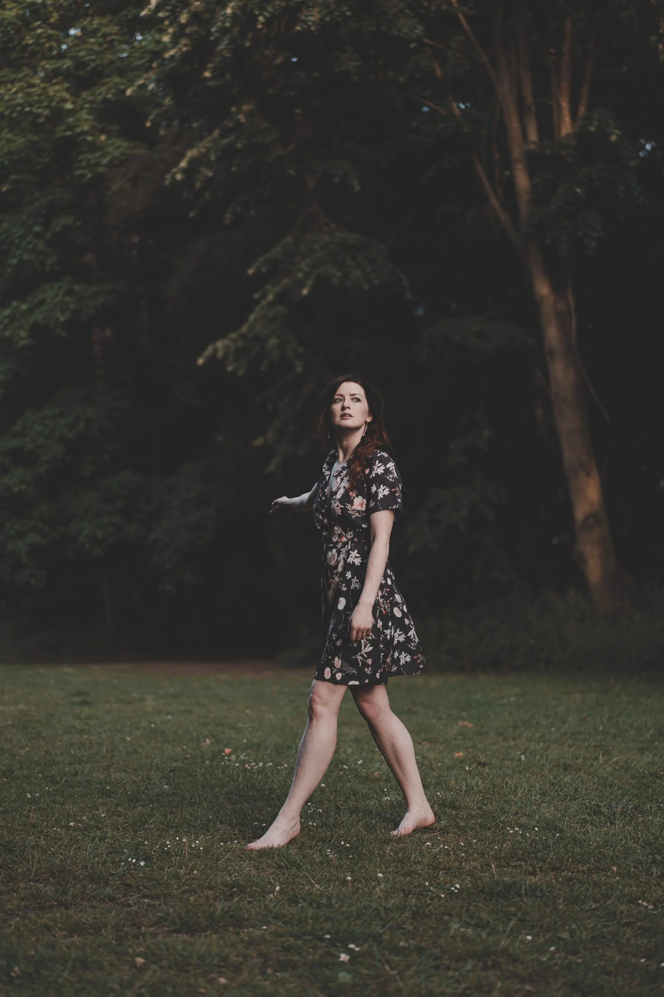 Barefoot woman walking through a Derbishire forest