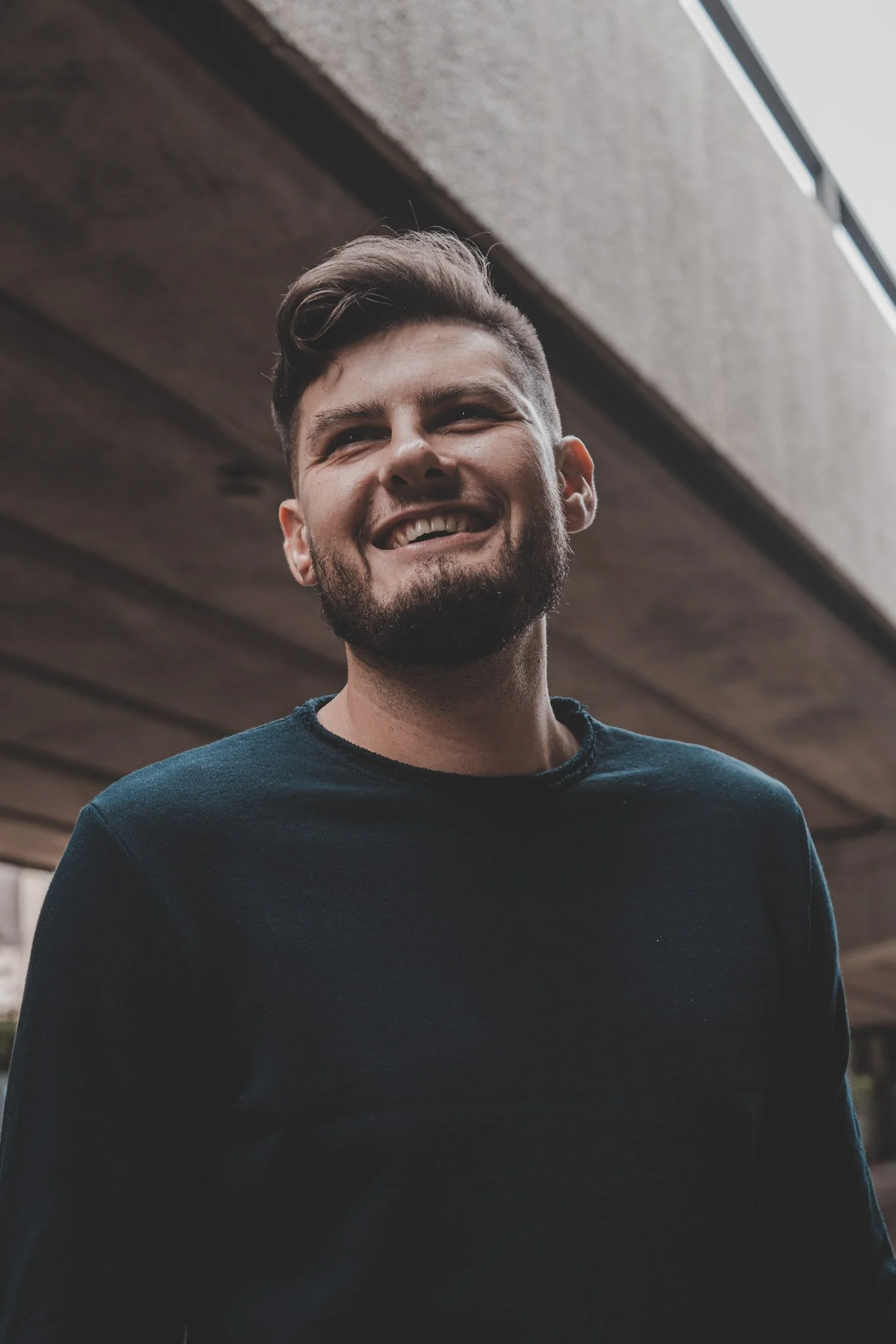 Portrait of a young man smiling during a photoshoot in Coventry
