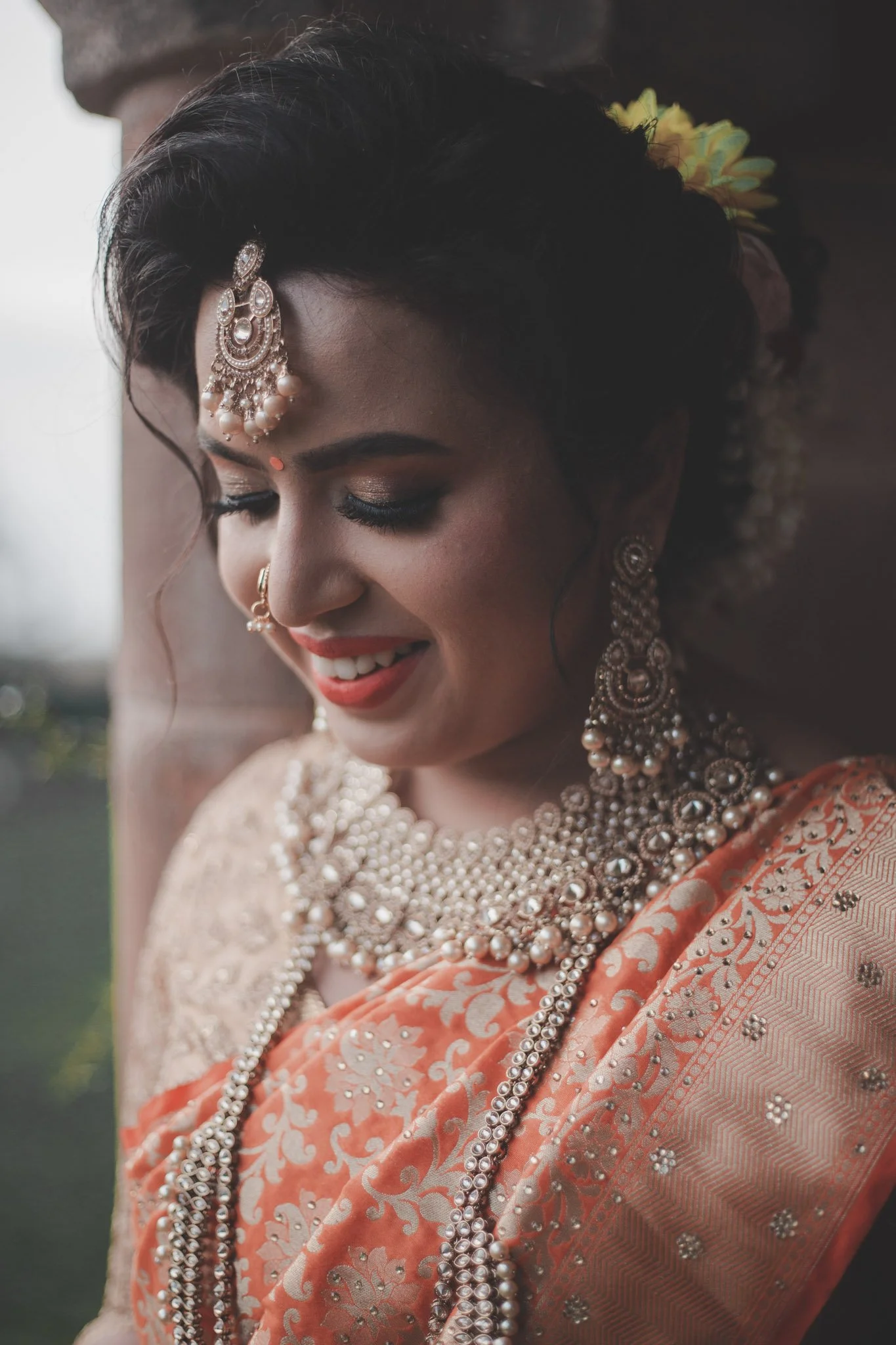Indian bride wearing traditional wedding dress smiling in Coventry