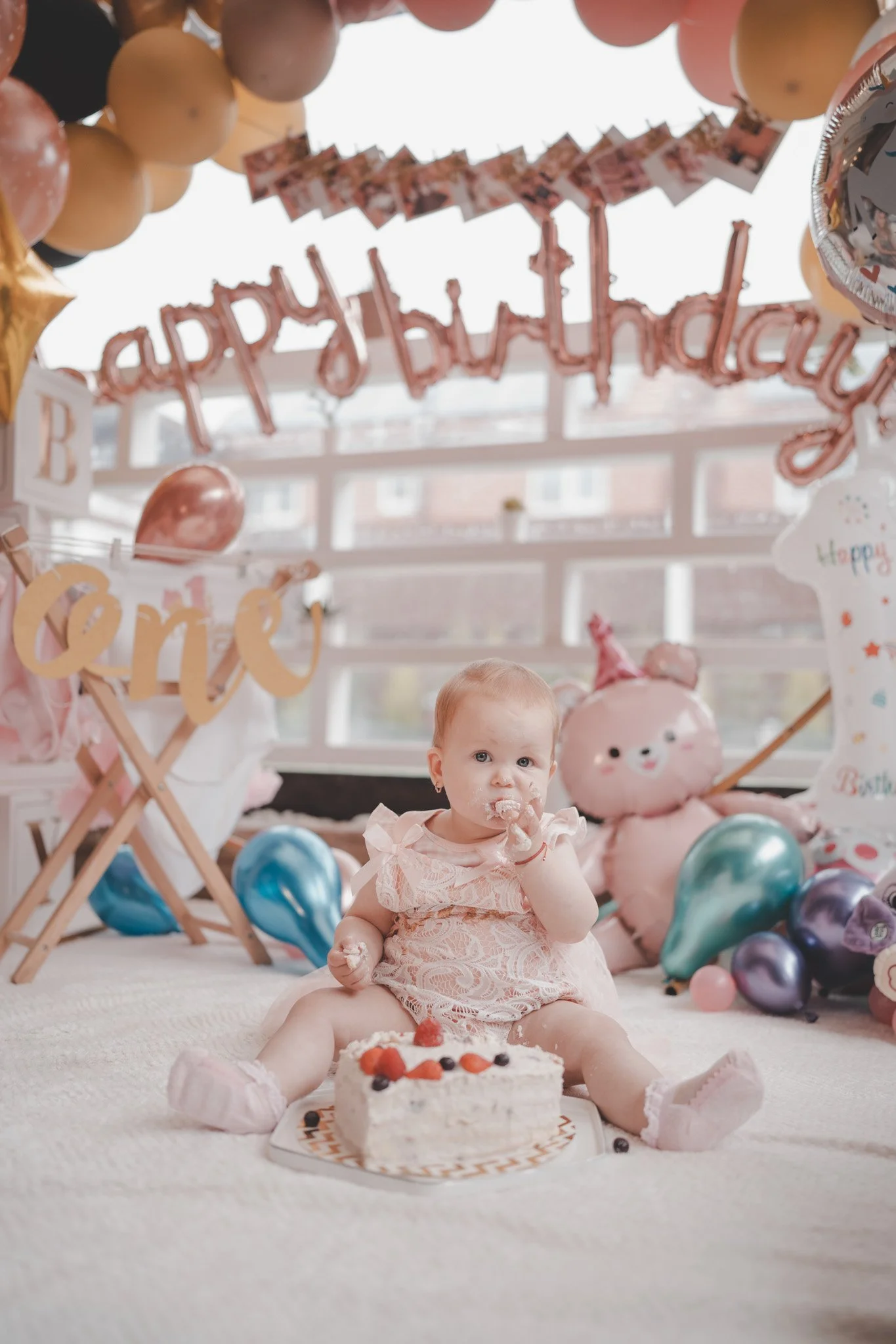 Photo of a baby girl wearing a pink dress at the smash the cake party in Coventry, West Midlands