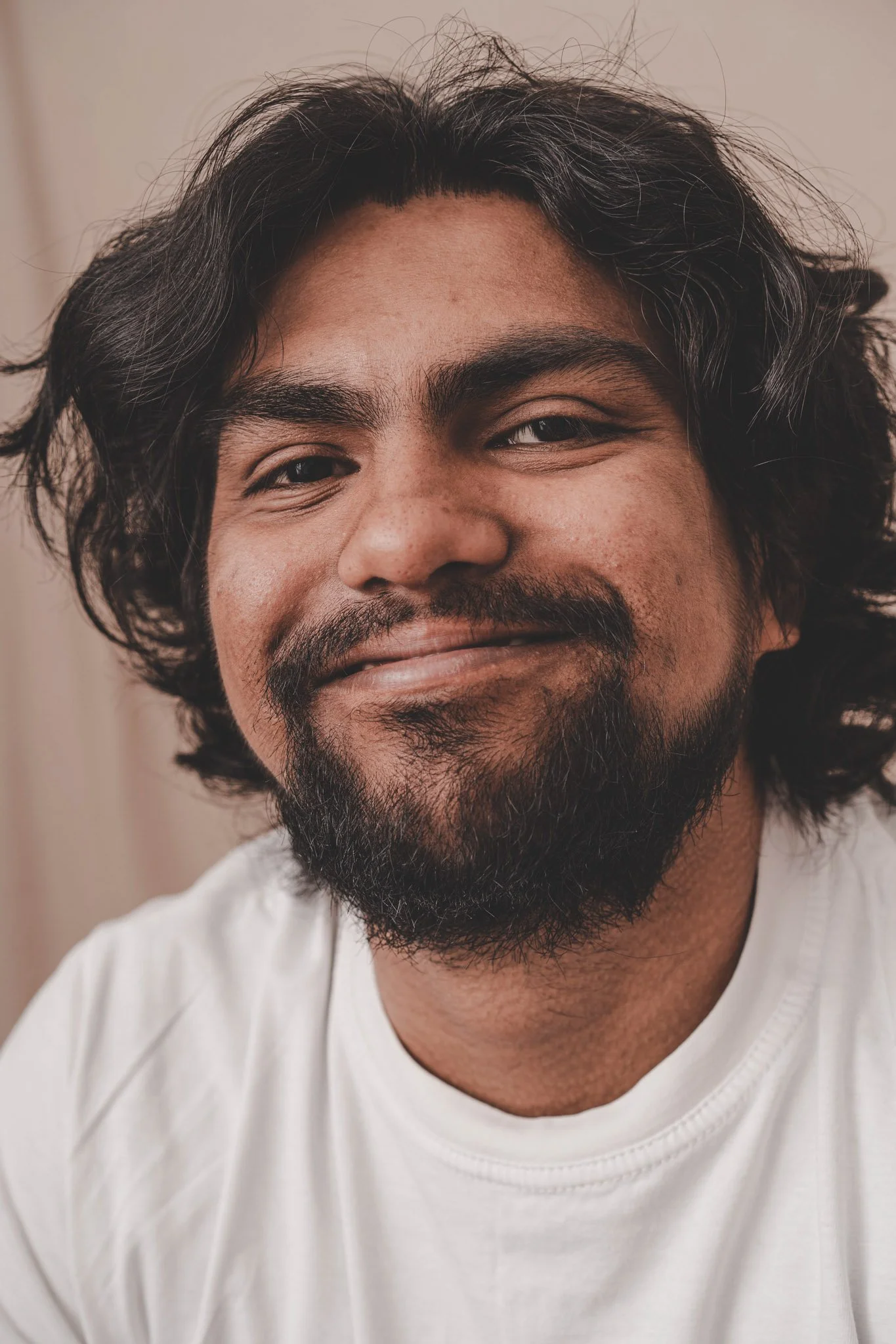 Indian man smiling at the camera