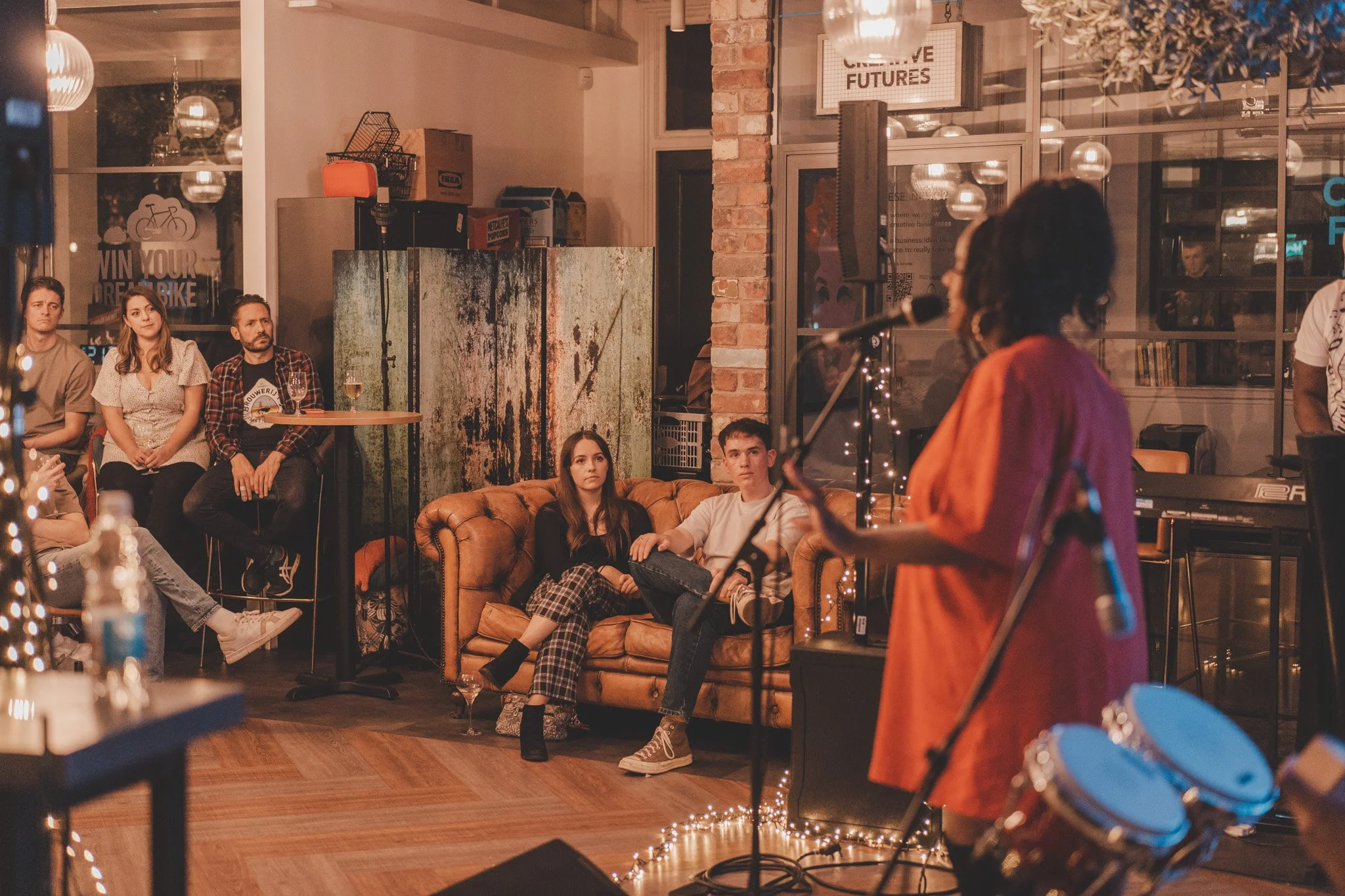 Audience members listening to Natty Ola at 1 Mill Street in Leamington Spa