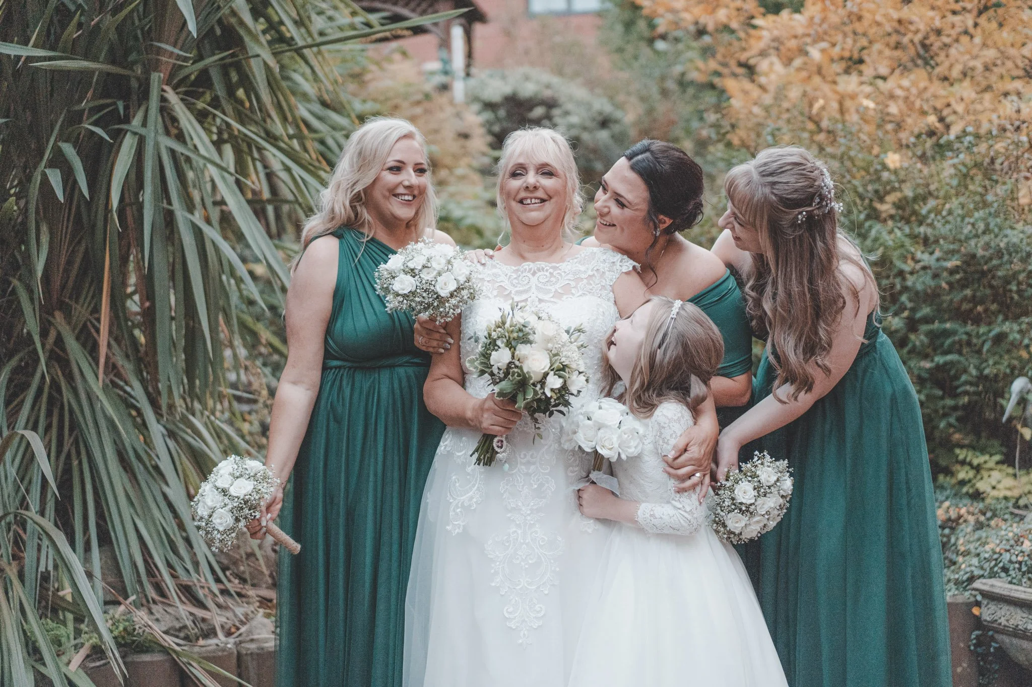 Bride photographed together with her daughters 