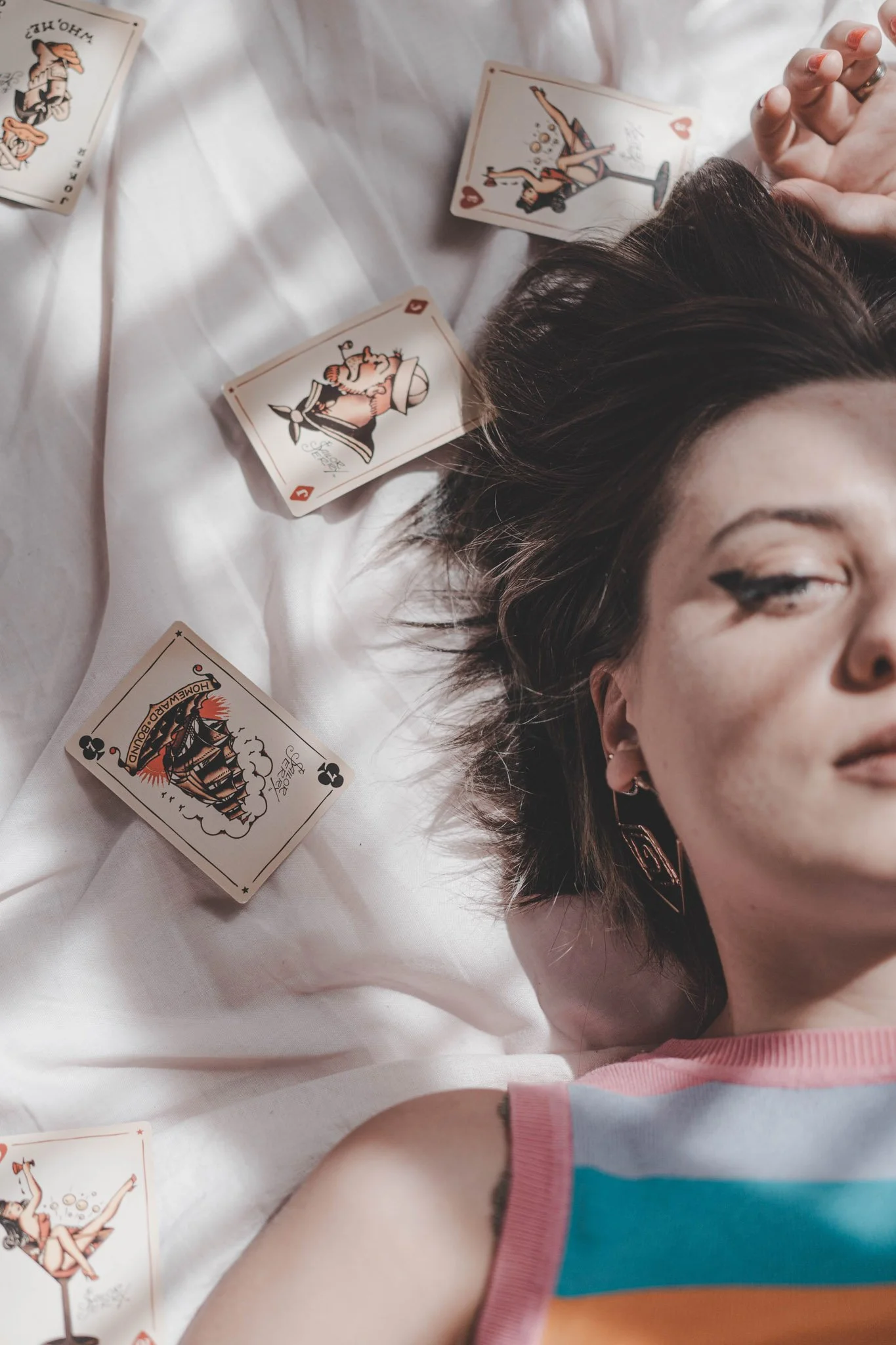 Detail of a girl's eye and vintage poker cards