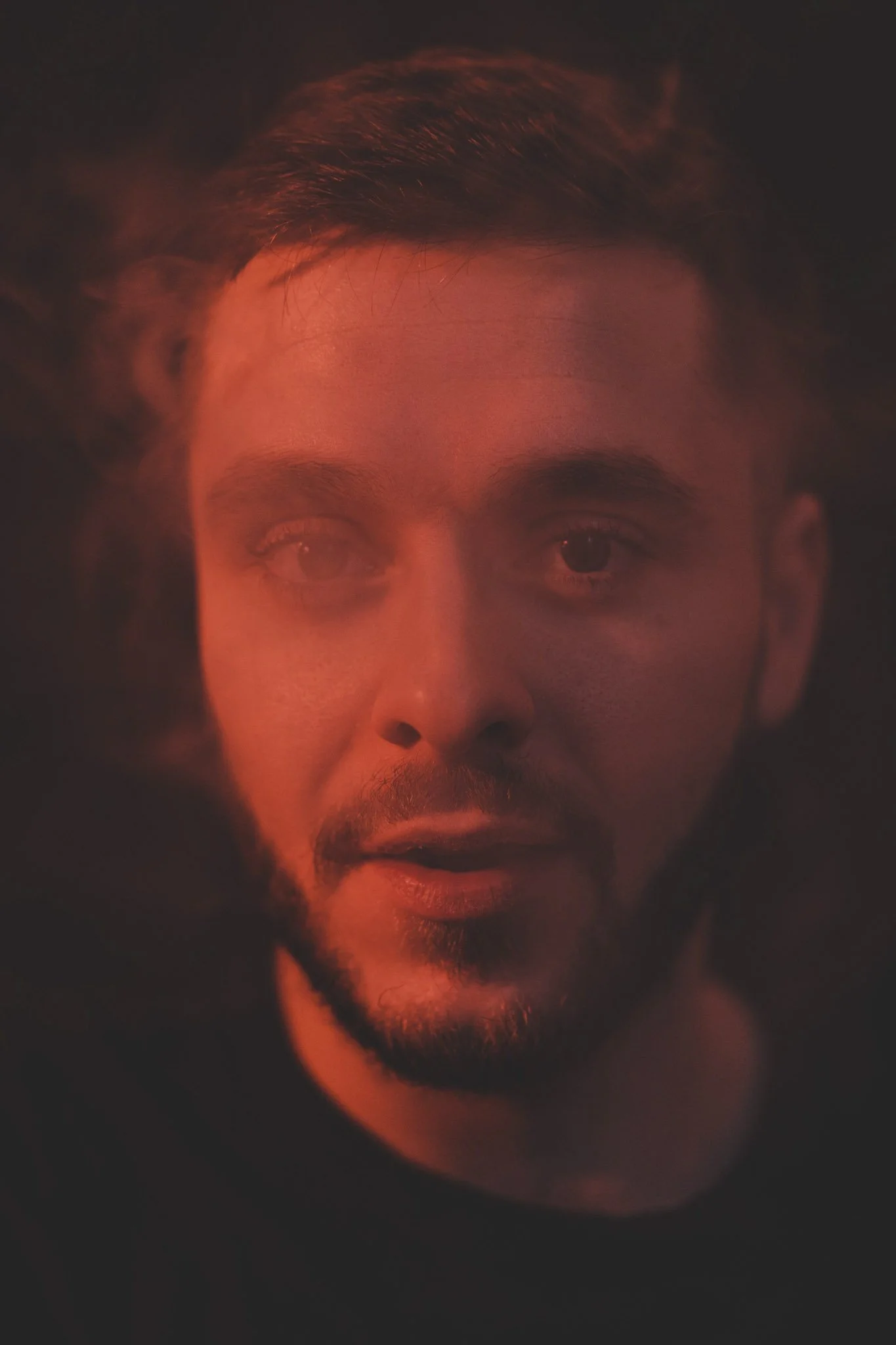 Close-up portrait of a boy blowing up smoke, in Coventry photography studio