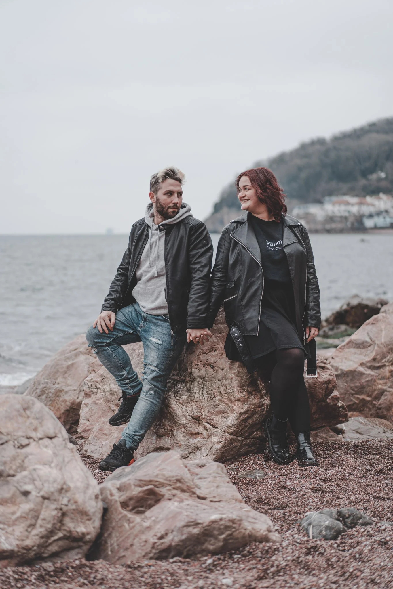 Photo of a couple looking at each other on a beach in Cornwall 