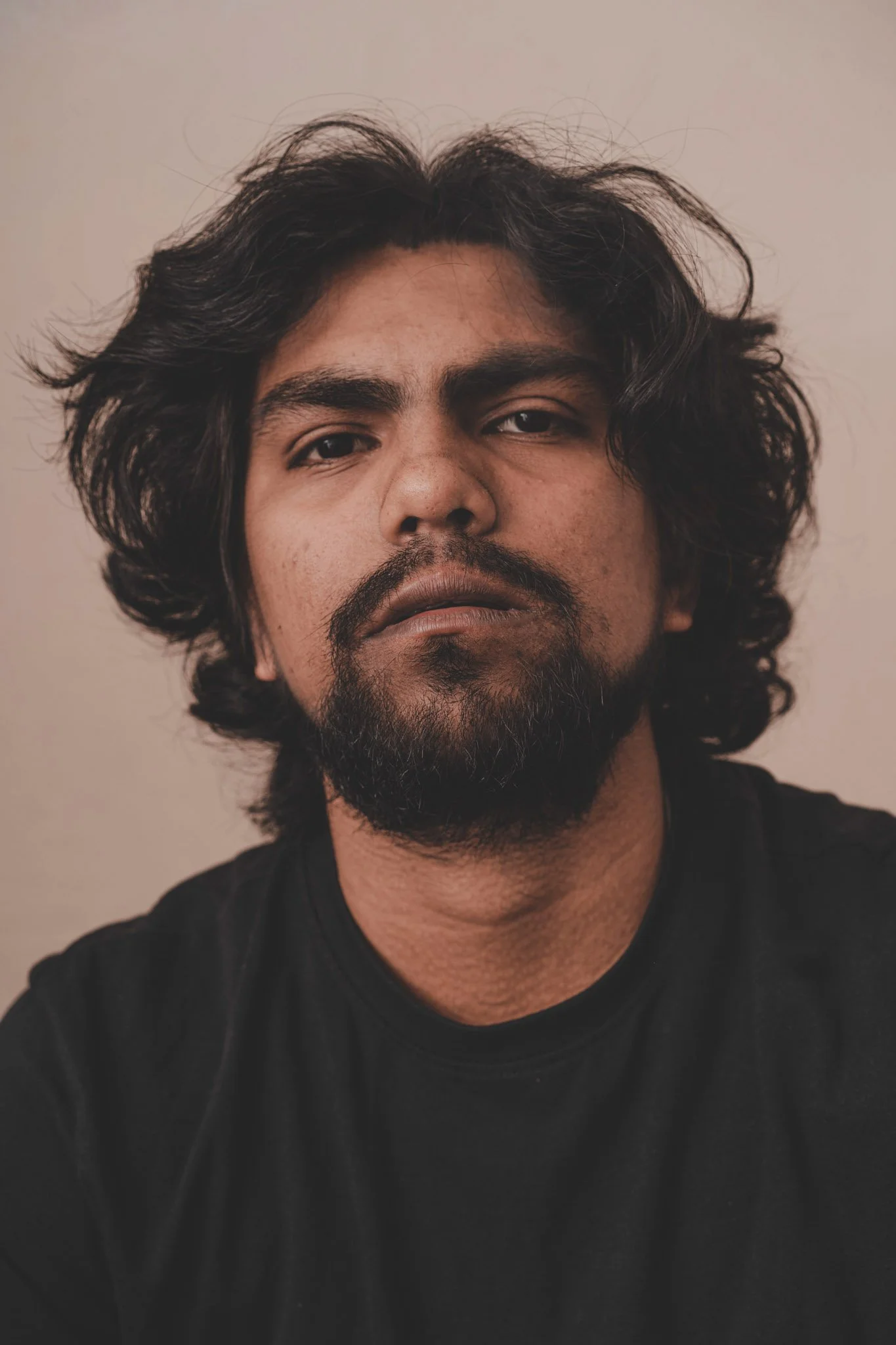 Portrait of an indian guy looking into the camera