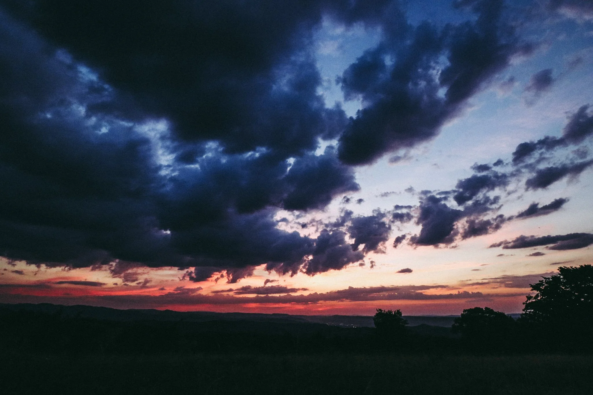 Landscape photo of Făget forest and clouds at sunset in Cluj, Romania