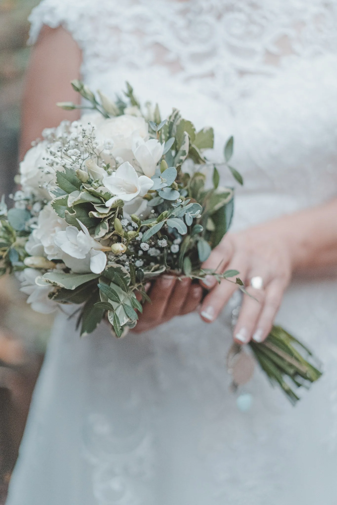 Detail of bride holding her flower bouquet