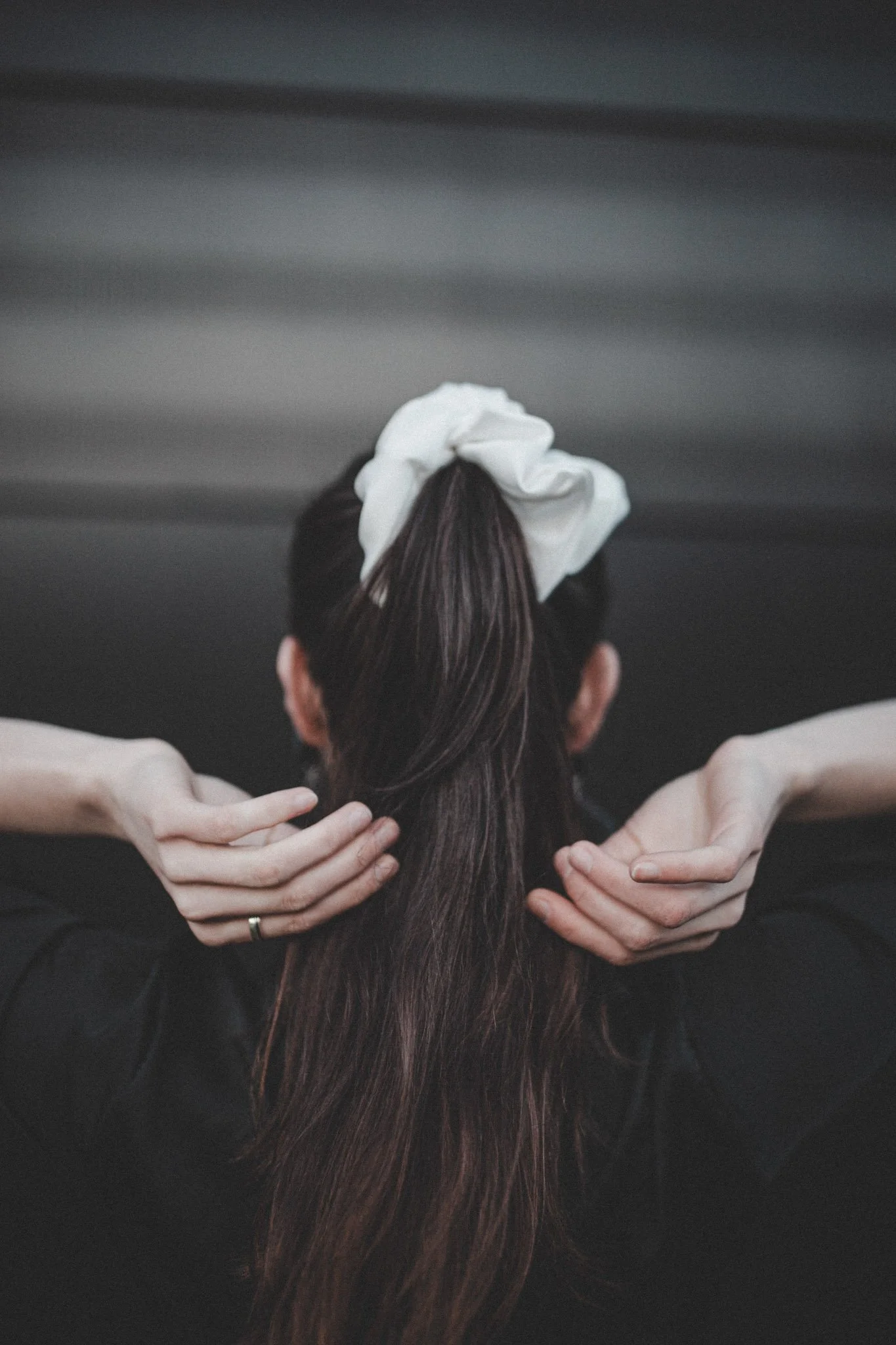 Product photography of a white hair band taken in Coventry, UK