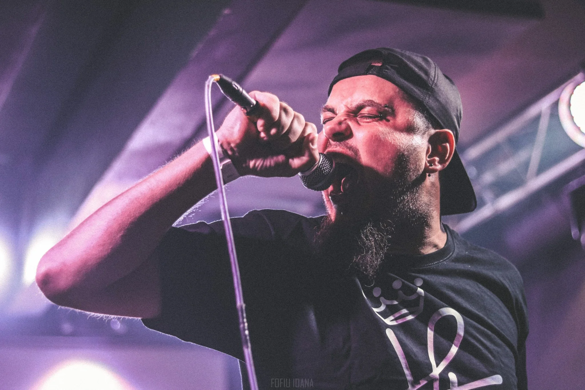 Portrait of Why Cat Why lead singer on stage