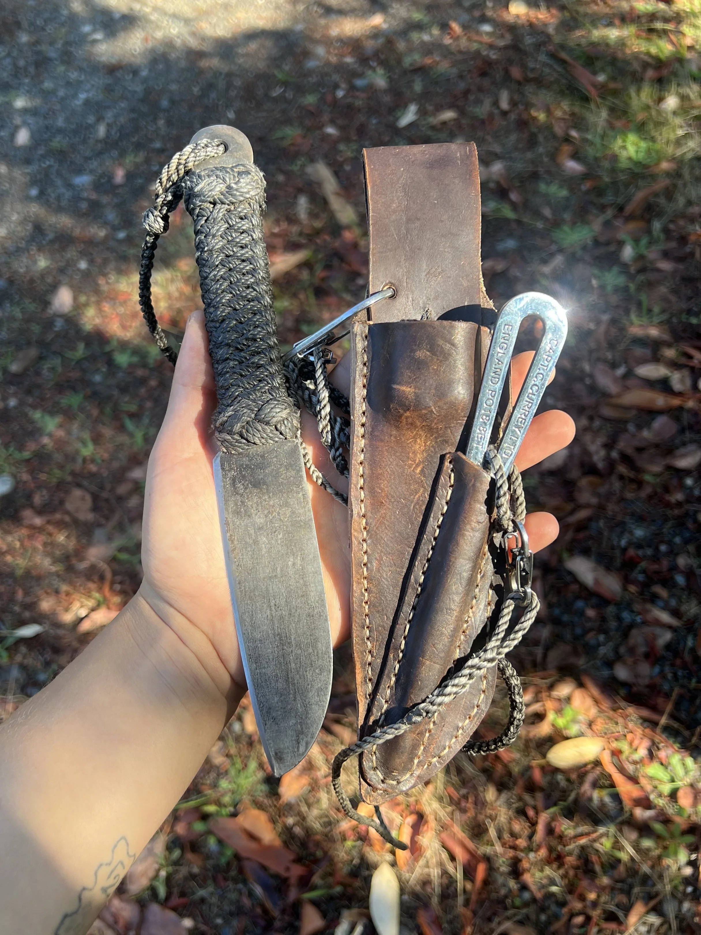 knotwork (coachwhipping, turk's heads, and lanyards) & leatherwork by me. 
rig knife forged by strykerforge.com, marlinspike from captaincurrey.com